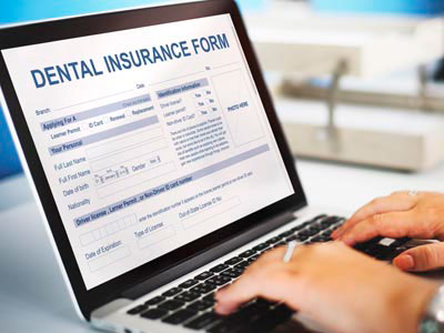 patient filling out a dental insurance form online