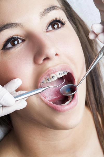 patient getting a checkup on her braces at Family Dental of Spokane Valley