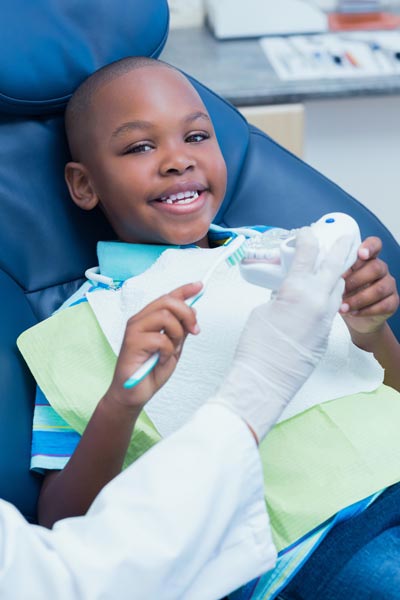 young boy smiling while visiting Family Dental of Spokane Valley