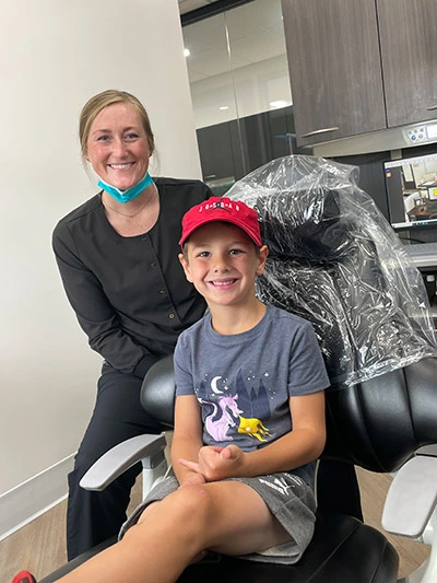 child with dental staff at Spokane, WA dentist office